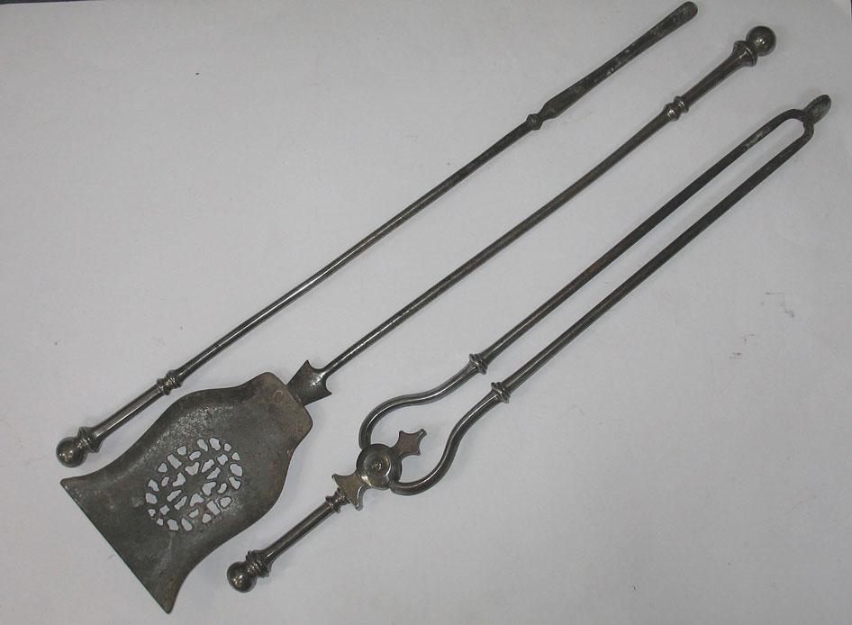 Appraisal: A SET OF THREE POLISHED STEEL FIRE IRONS with extended