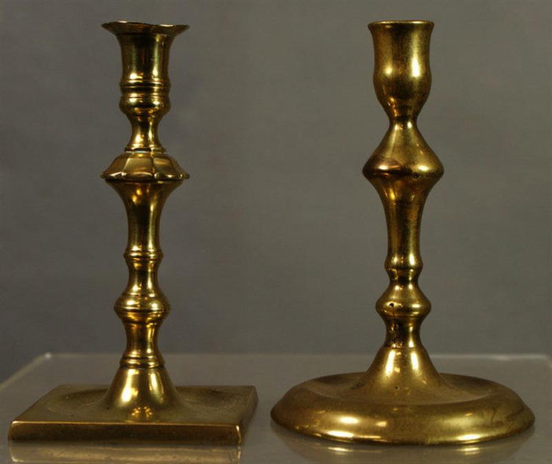 Appraisal: early brass saucer base QA candlesticks one ex Schiffer tall