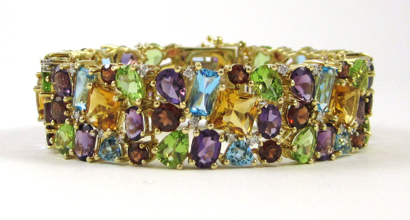 Appraisal: MULTI COLORED GEMSTONE AND DIAMOND BRACELET The k yellow gold