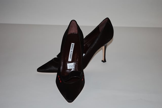 Appraisal: Manolo Blahnik black fur leather pumps w red trimming on