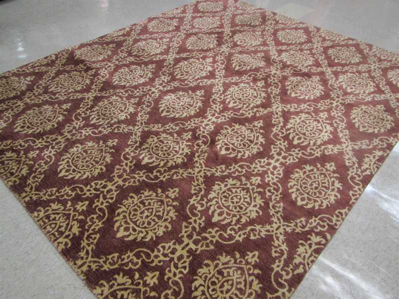 Appraisal: HAND KNOTTED ORIENTAL CARPET Indo-Persian contemporary repeating panel design in