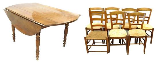 Appraisal: th C drop leaf dining table and seven chairs oak