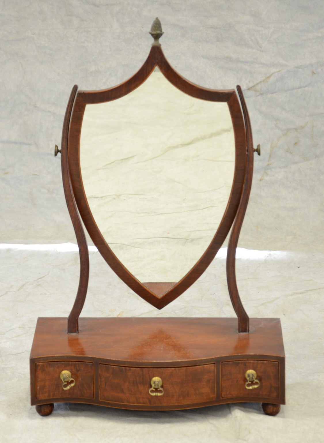 Appraisal: Hepplewhite mahogany shaving mirror with serpentine front and drawers shield