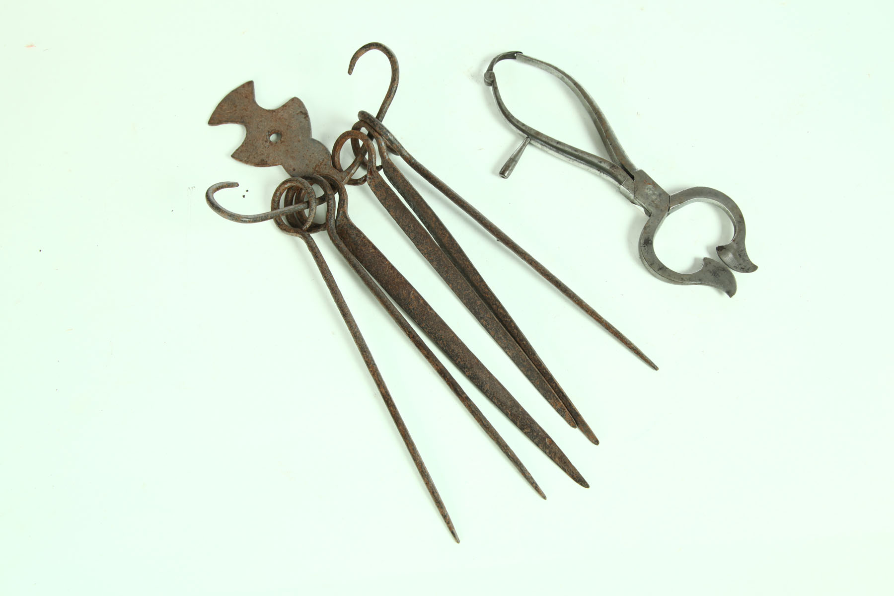 Appraisal: WROUGHT IRON SUGAR NIPPERS AND SKEWERS American th century Assembled