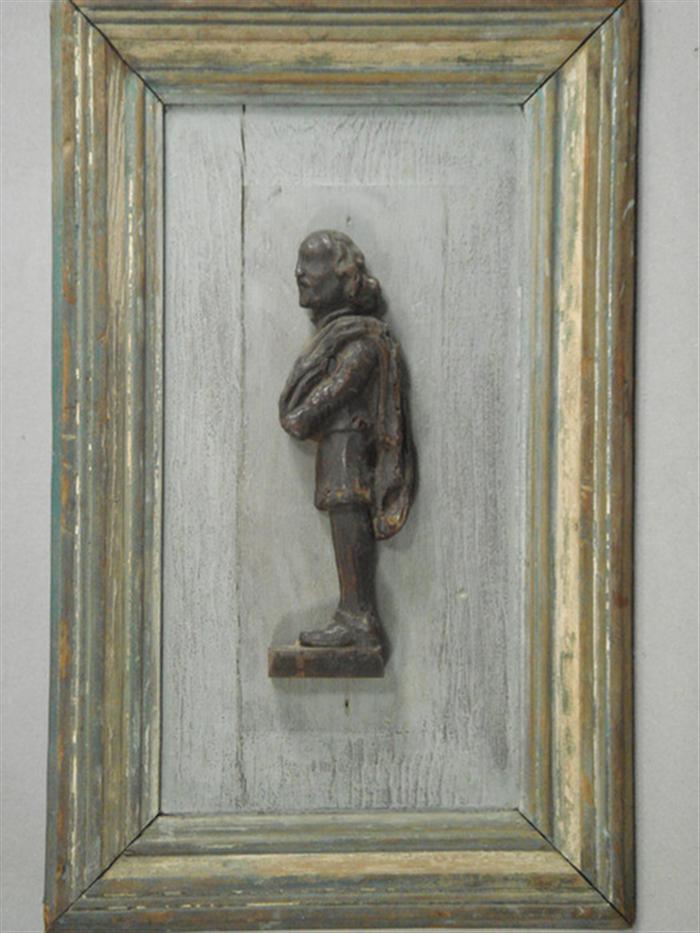 Appraisal: Carved wooden profile of a standing man mounted on painted