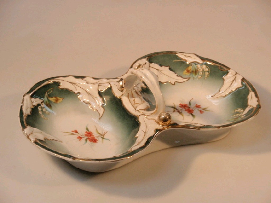 Appraisal: A German porcelain two-section hors-d'oeuvre's dish