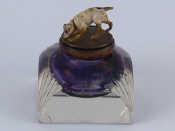 Appraisal: A glass inkwell the lid with cold painted bronze dog