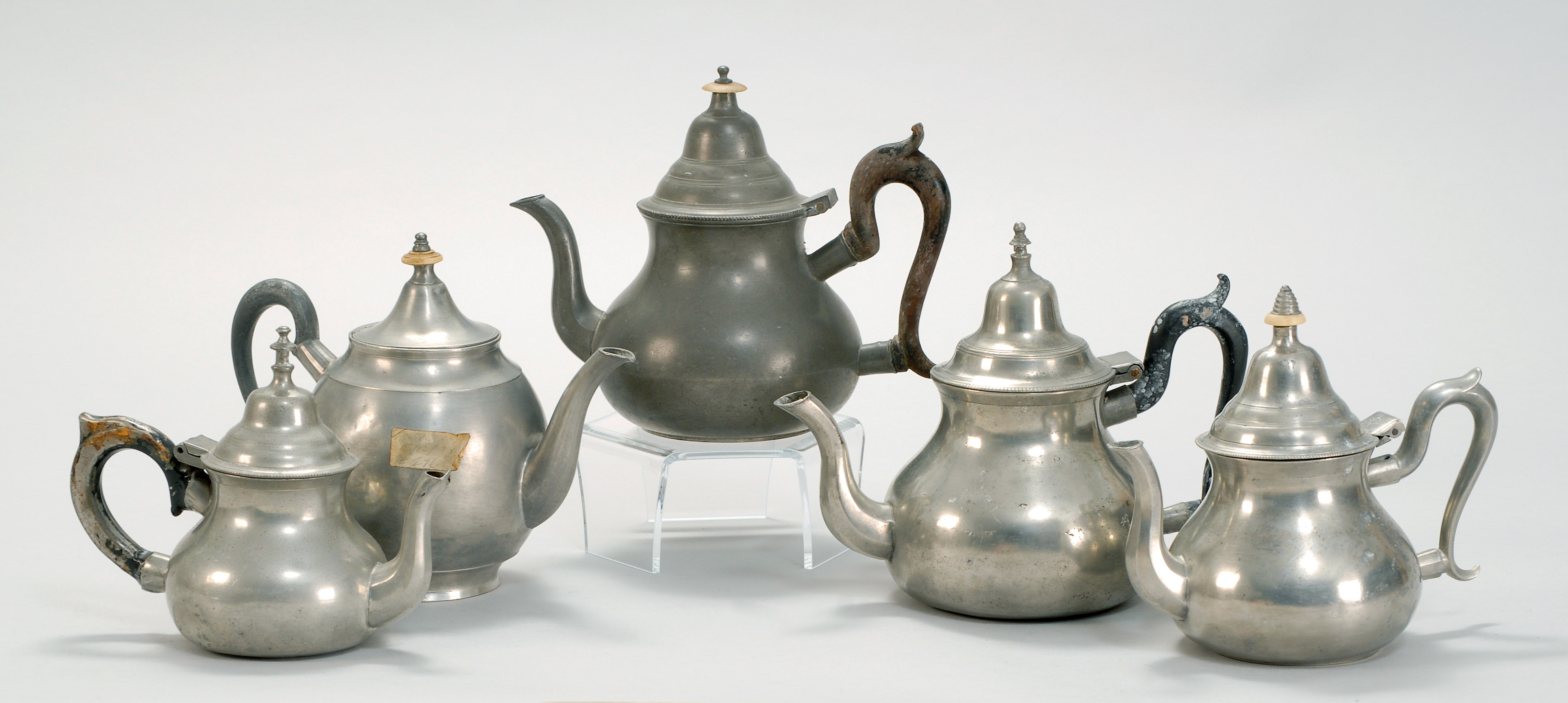 Appraisal: FIVE ANTIQUE ENGLISH PEWTER TEAPOTS Late th Early th CenturyMaker's