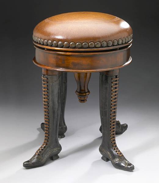 Appraisal: A Continental piano stool modern The circular upholstered revolving seat