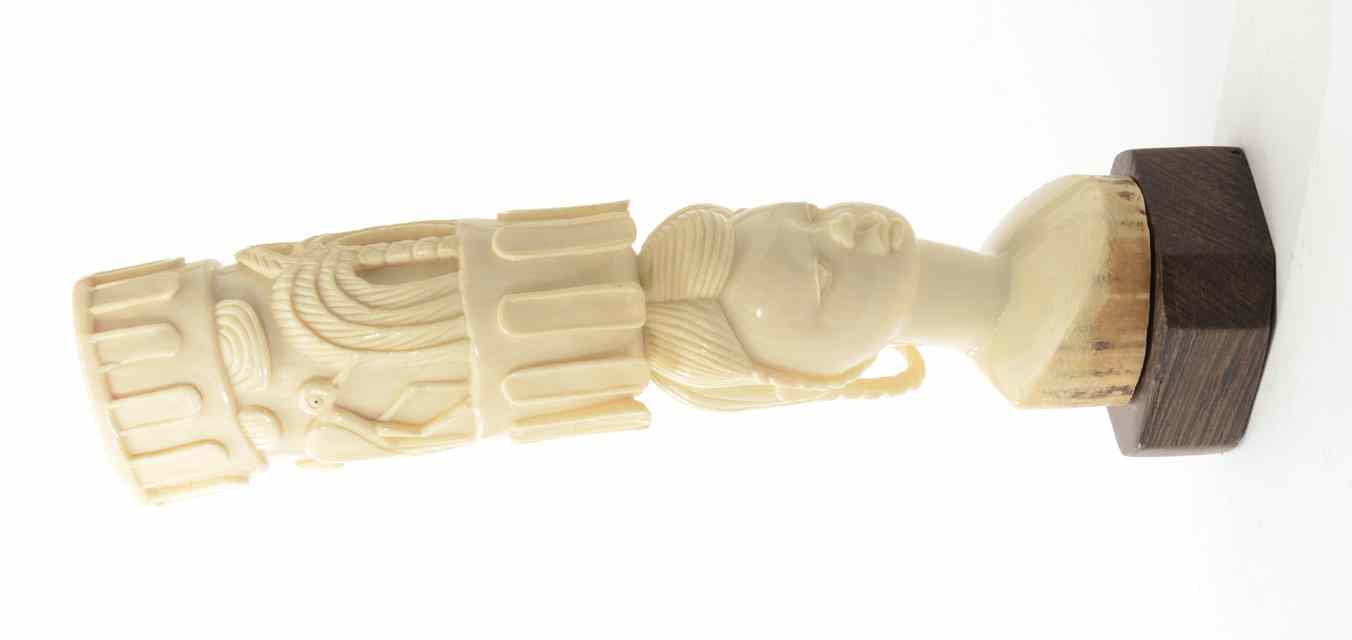 Appraisal: AN AFRICAN ELEPHANT IVORY CARVING consisting of a female bust