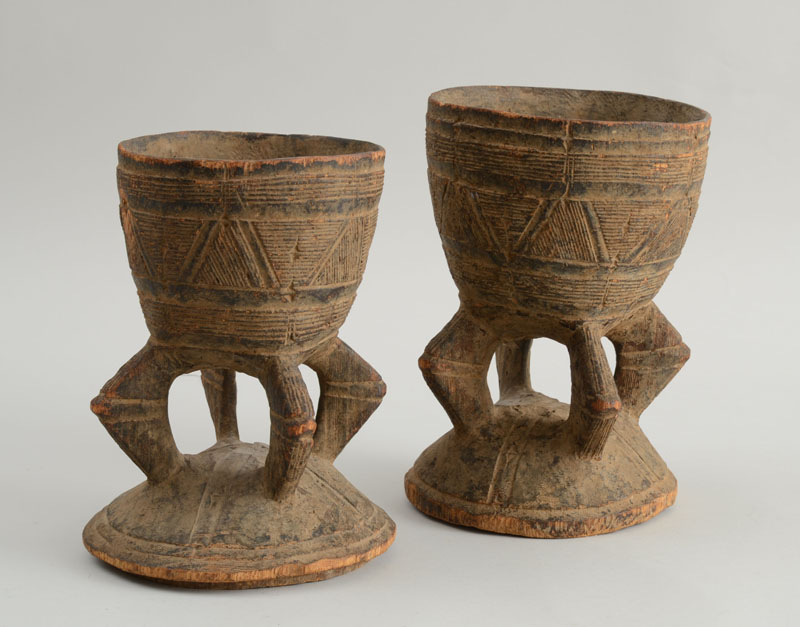 Appraisal: ASSEMBLED PAIR OF AFRICAN CARVED WOOD VESSELS Each bowl incised