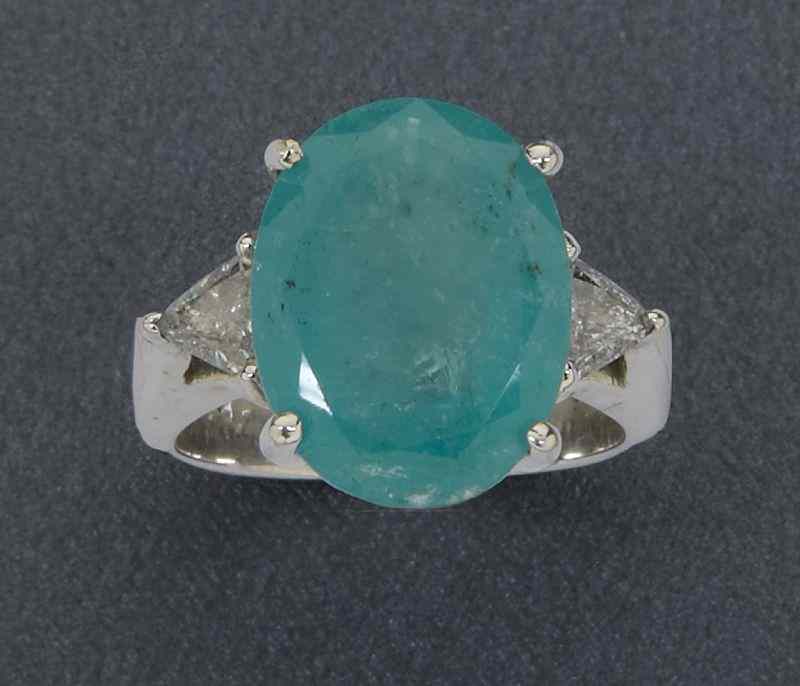 Appraisal: K gold emerald and diamond dinner ring having an oval