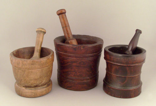 Appraisal: Three turned burlwood mortar and pestles th c h h