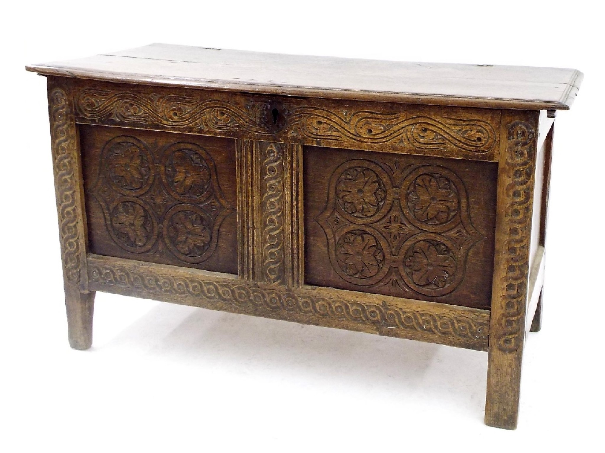 Appraisal: Antique oak twin panelled coffer with carved scrolled floral decoration