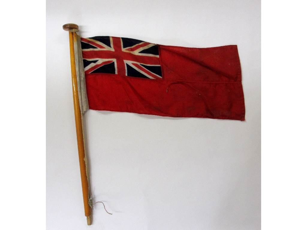 Appraisal: A red ensign with cruiser flag pole ensign x cm