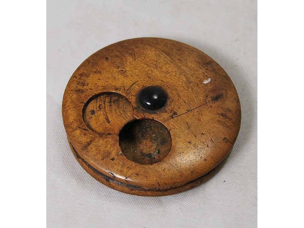 Appraisal: A turned boxwood disc-shaped coin purse