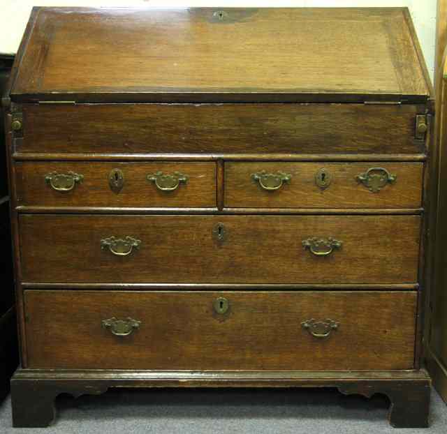 Appraisal: A George III and later oak bureau the fall front