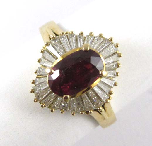 Appraisal: RUBY DIAMOND AND EIGHTEEN KARAT GOLD RING with baguette-cut diamonds