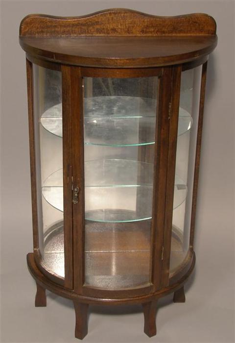 Appraisal: MINIATURE VICTORIAN STYLE MAHOGANY AND GLASS DISPLAY CABINET Enclosing glass