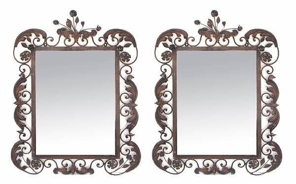 Appraisal: A pair of wrought iron and tole mirrors height in