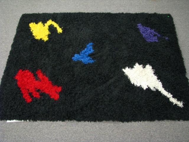 Appraisal: Contemporary area rug black field with primary color splashes '