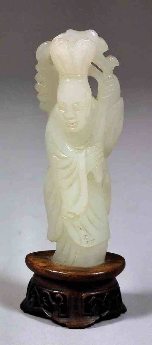 Appraisal: A small Chinese celadon jade figure of a maiden modelled