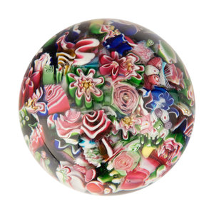 Appraisal: A Clichy End-of-Day Scrambled Millefiori Glass Paperweight with interspersed rose