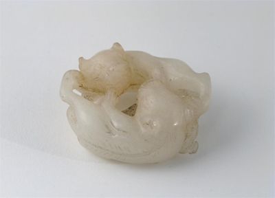 Appraisal: A Chinese white jade carving of two mythical beasts their