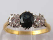 Appraisal: A yellow metal tests carat gold sapphire and diamond ring