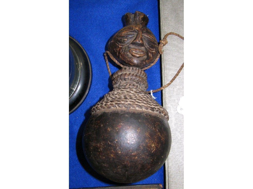 Appraisal: Carved wood ethnic water bottle