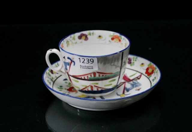 Appraisal: A New Hall bute shape teacup and saucer Circa painted