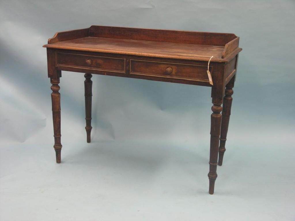 Appraisal: A Victorian mahogany writing table enclosed top above two frieze