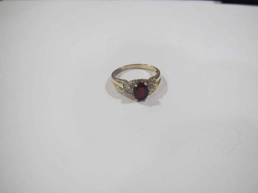 Appraisal: Gold ruby and diamond set dress ring with central oval