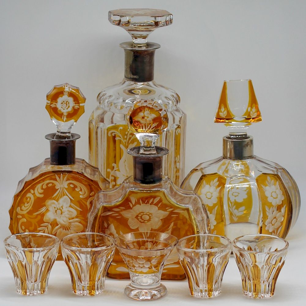 Appraisal: SILVER Silver Mounted Decanter Grouping Includes silver mounted cut to