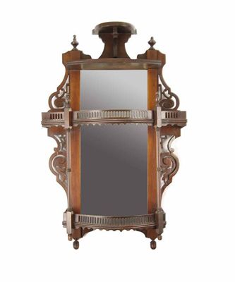 Appraisal: A pair of mahogany wall shelves each with bevelled mirror