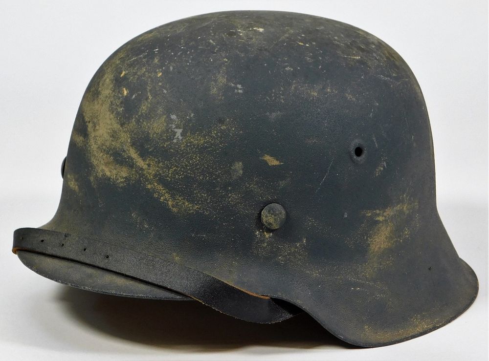 Appraisal: Repainted German M- Helmet Germany Gray-painted shell with sawdust finish