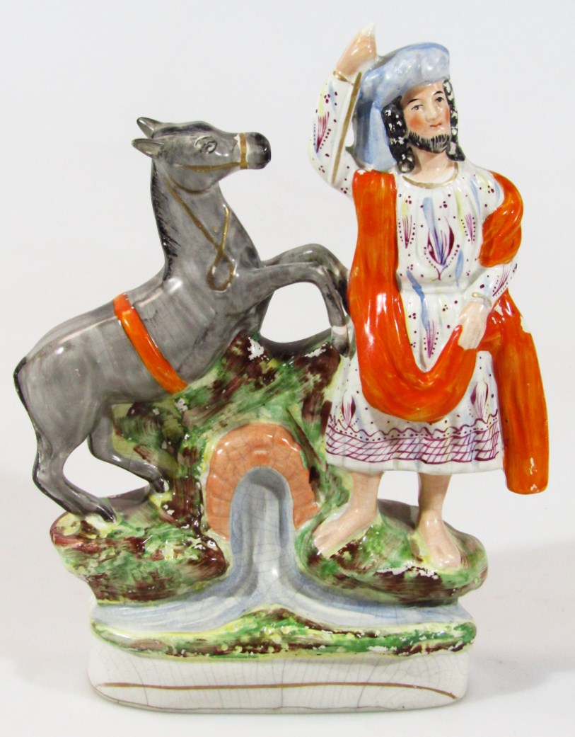 Appraisal: A thC religious Staffordshire figure of a gentleman in flowing