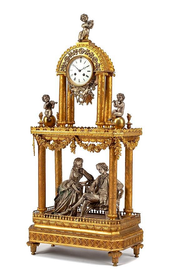 Appraisal: A French Gilt and Silvered Bronze Figural Clock Height inches