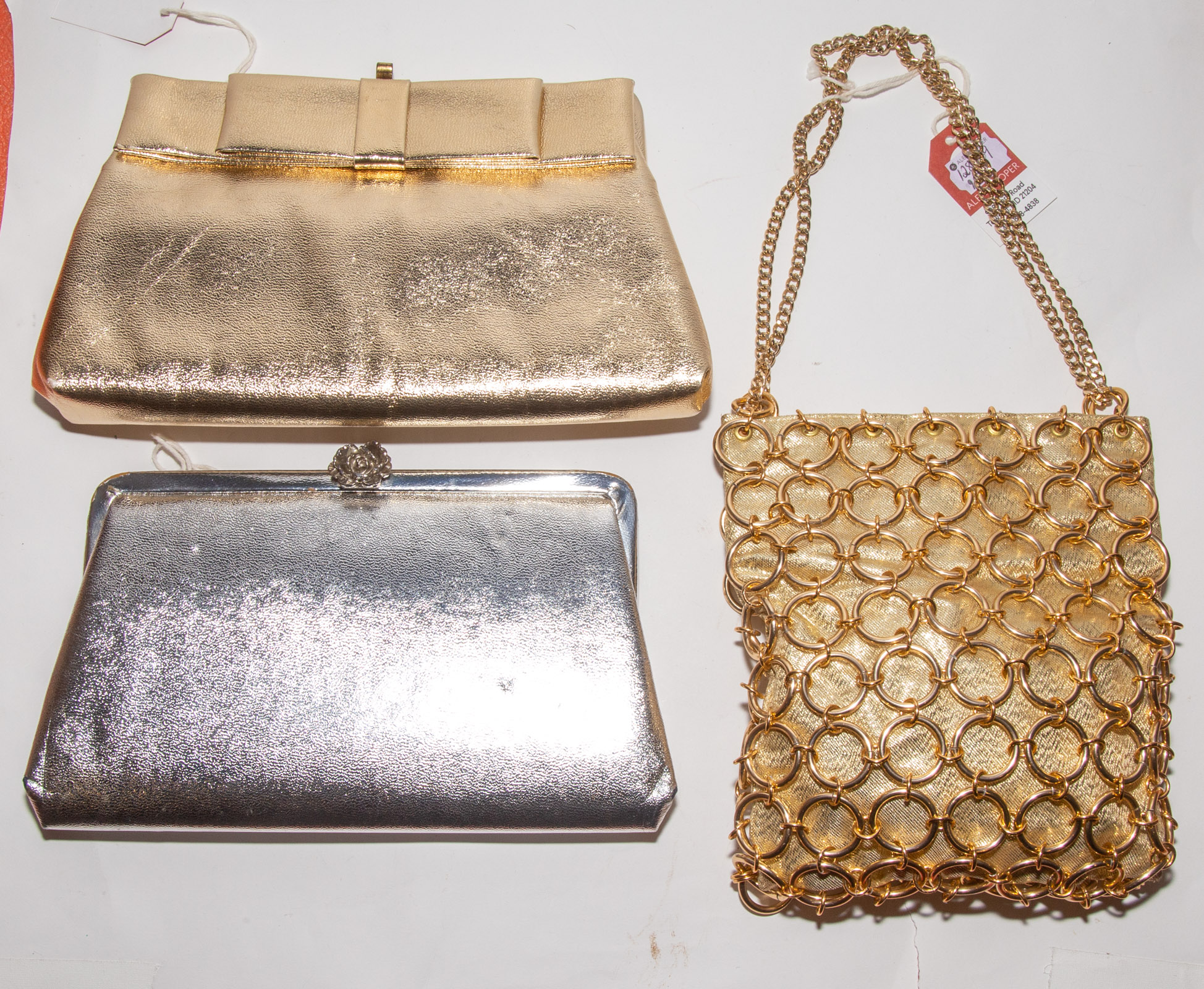 Appraisal: THREE VINTAGE METALLIC EVENING BAGS including a Magid caged gold