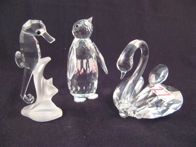 Appraisal: THREE SWAROVSKI AUSTRIAN CUT CRYSTAL FIGURES Penguin faceted crystal with