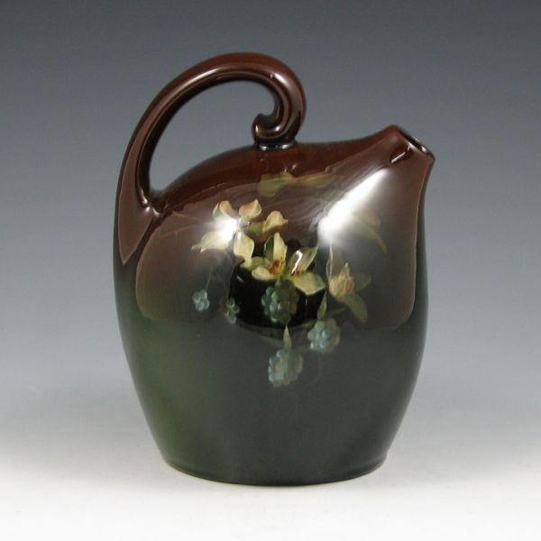 Appraisal: Owens Lightweight standard glaze jug with berry and flower decoration