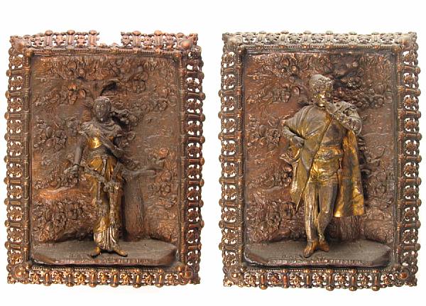 Appraisal: A pair of patinated metal wall plaques height in width