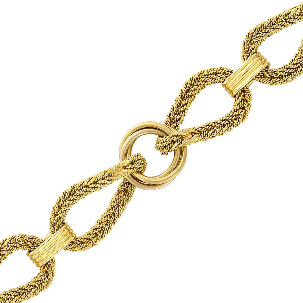 Appraisal: Braided Gold and Two-Color Gold Link Bracelet kt ap dwts