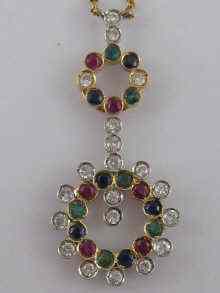 Appraisal: An carat gold pendant set with diamonds sapphire emeralds and