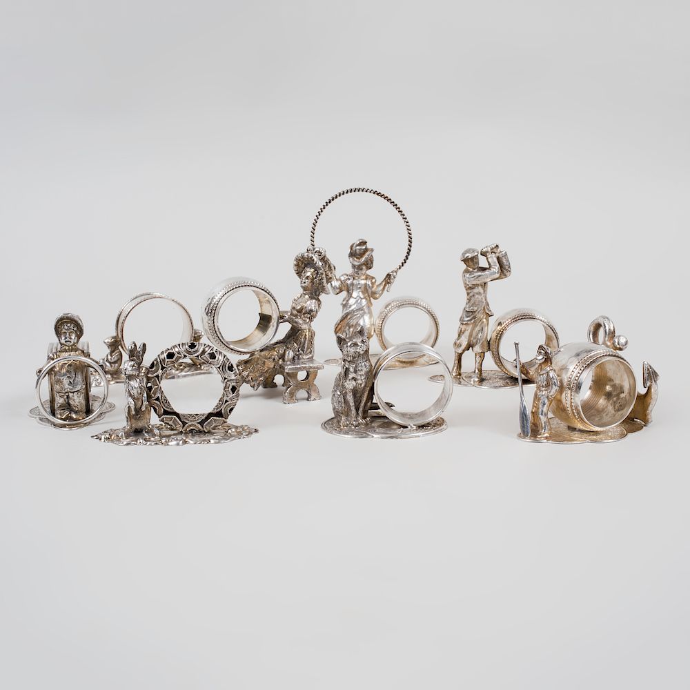 Appraisal: Group of Twenty-One Figural Silver Plate Napkin Rings The largest