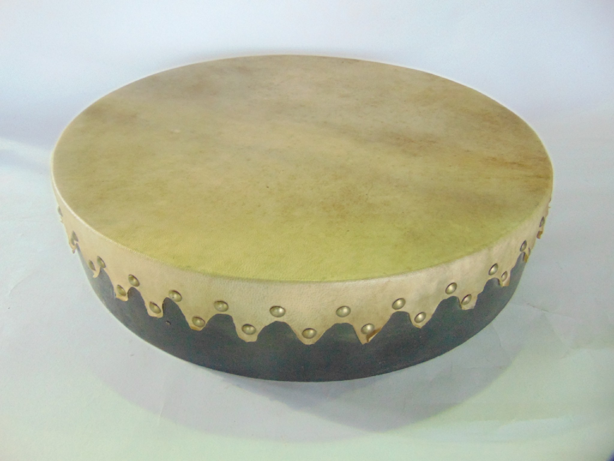 Appraisal: A simple hide drum or Bodhran of circular form with