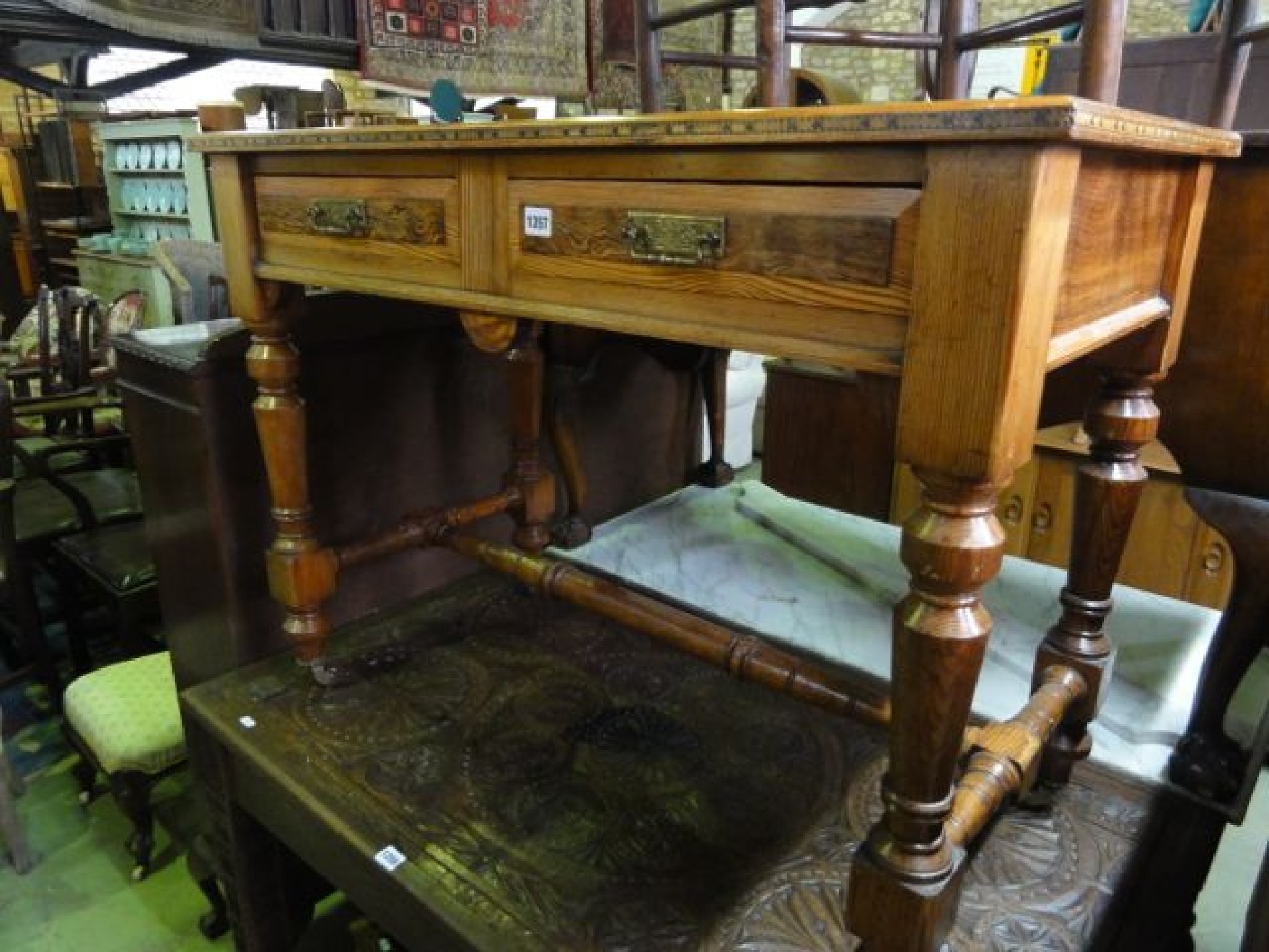 Appraisal: A Victorian pitch pine two drawer writing table with inset