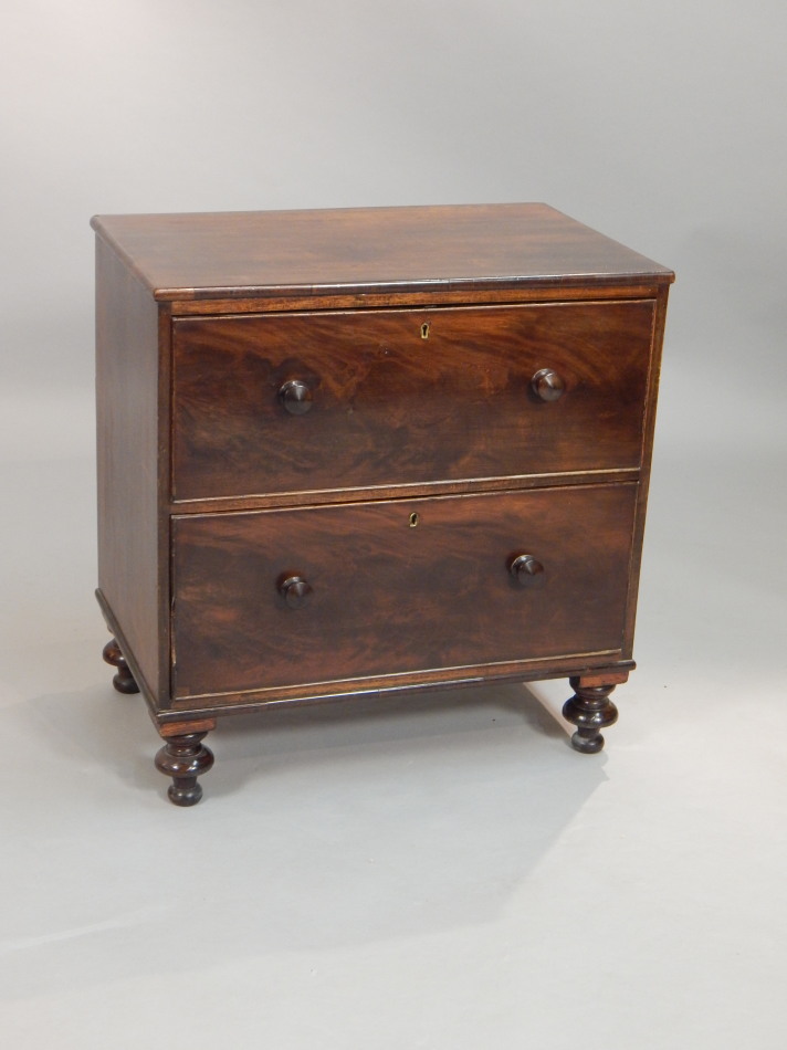 Appraisal: A thC mahogany small chest with two drawers each with