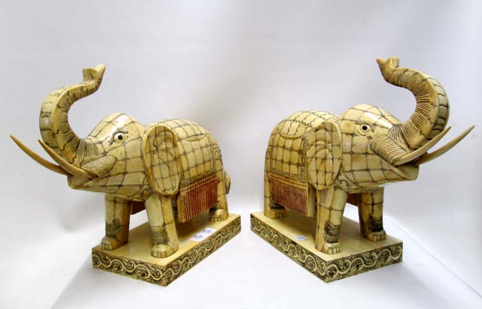 Appraisal: PAIR CHINESE FIGURAL BONE ELEPHANTS bone tiles on wood construction