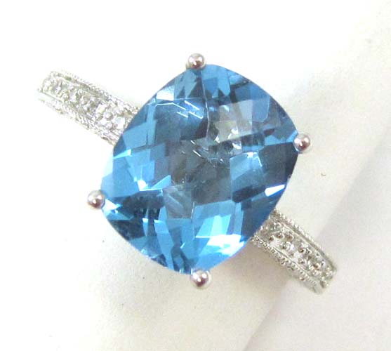 Appraisal: BLUE TOPAZ DIAMOND AND FOURTEEN KARAT WHITE GOLD RING featuring